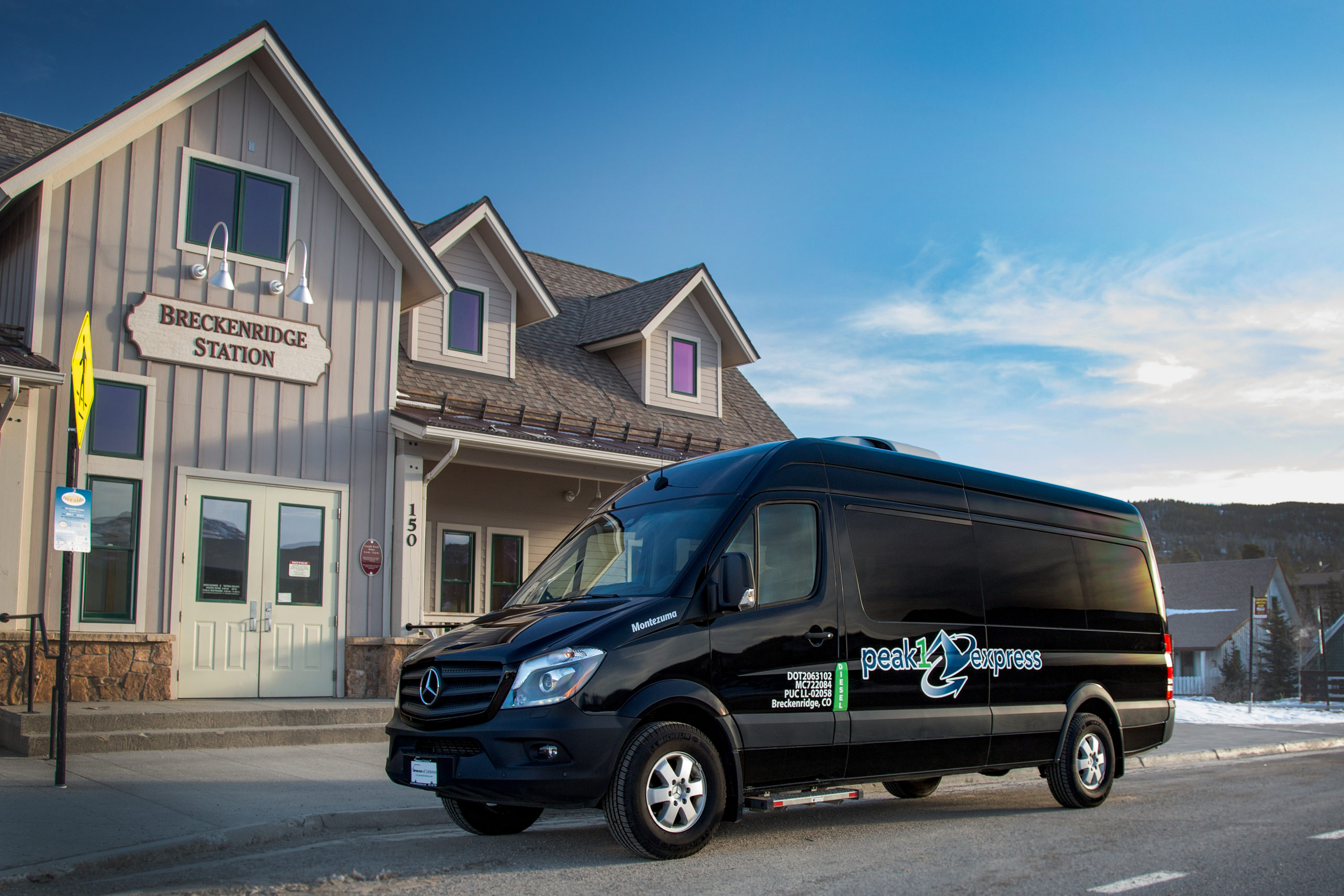 Peak 1 Express shuttle in front of Breckenridge Station