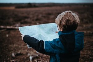 boy holding map