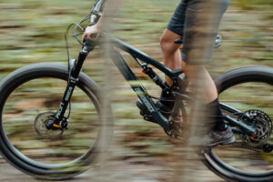 person biking, close up on wheels