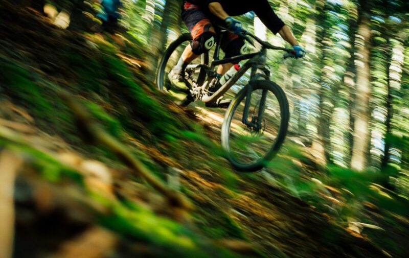 downhill biking through forest