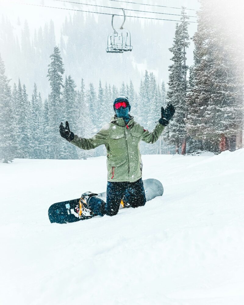 snowing on snowboarder